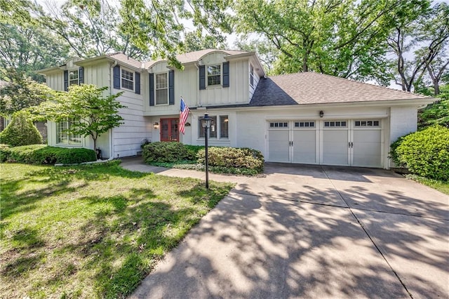 8911 W 105th Ter, Overland Park, KS 66212 - traditional-style home featuring board and batten siding, concrete driveway, an attached garage, and a front lawn