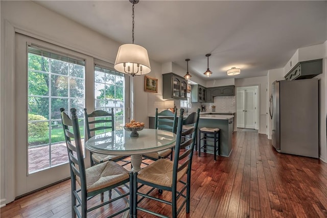 8911 W 105th Ter, Overland Park, KS 66212 - dining room featuring plenty of natural light and dark wood-type flooring