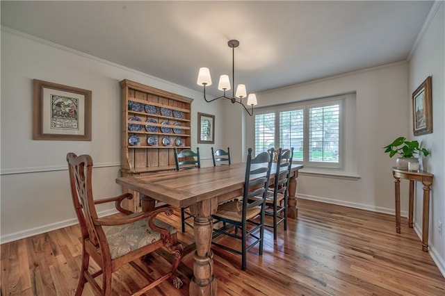 8911 W 105th Ter, Overland Park, KS 66212 - dining area featuring healthy amount of natural light, wood finished floors, crown molding, and baseboards