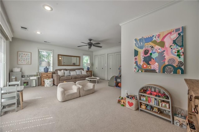 8911 W 105th Ter, Overland Park, KS 66212 - carpeted living area featuring ceiling fan, ornamental molding, and recessed lighting