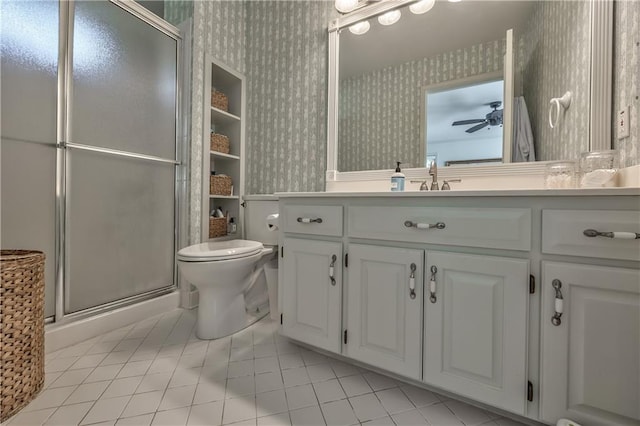 8911 W 105th Ter, Overland Park, KS 66212 - bathroom featuring wallpapered walls, tile patterned floors, vanity, a stall shower, and toilet