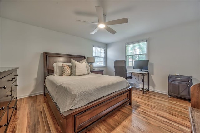 8911 W 105th Ter, Overland Park, KS 66212 - bedroom featuring light wood finished floors, baseboards, and ceiling fan