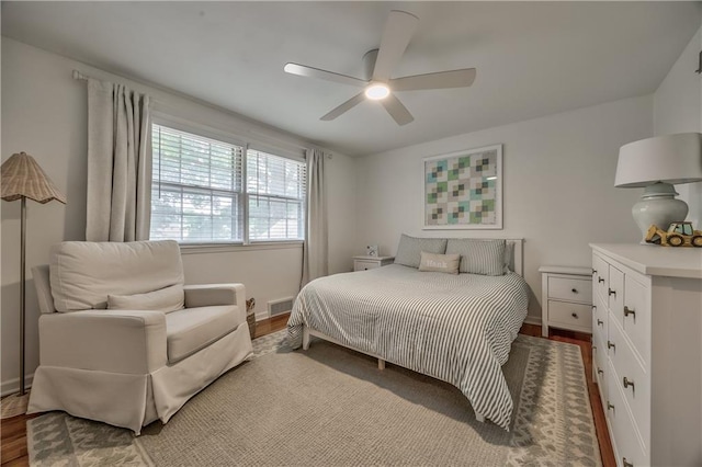 8911 W 105th Ter, Overland Park, KS 66212 - bedroom featuring wood finished floors, baseboards, and a ceiling fan