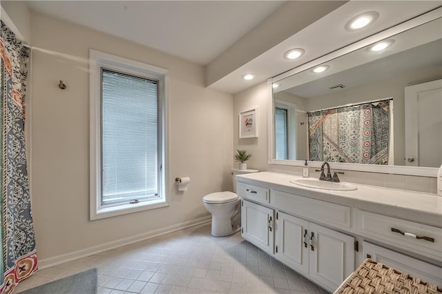 8911 W 105th Ter, Overland Park, KS 66212 - bathroom featuring recessed lighting, tile patterned flooring, baseboards, vanity, and toilet