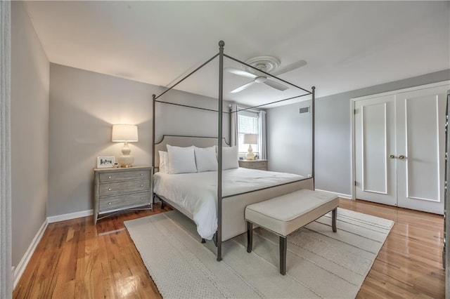 8911 W 105th Ter, Overland Park, KS 66212 - bedroom featuring baseboards, wood finished floors, and a ceiling fan