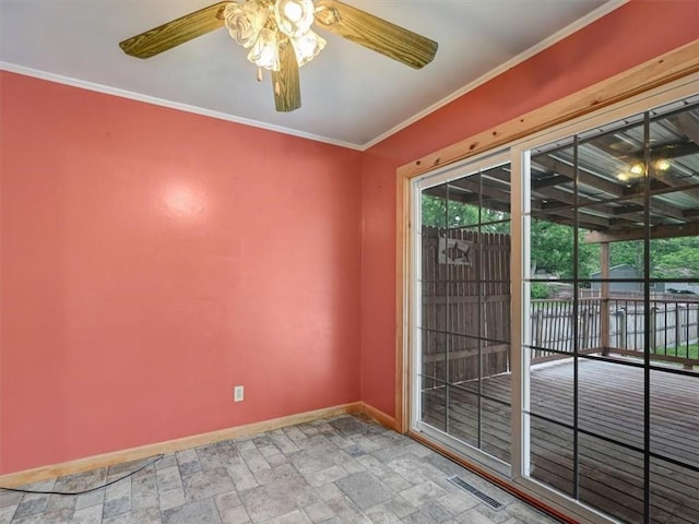 610 Morgan St, Lansing, KS 66043 - empty room featuring baseboards, a ceiling fan, stone finish flooring, and ornamental molding