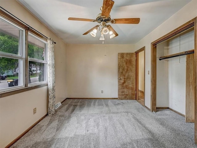 610 Morgan St, Lansing, KS 66043 - unfurnished bedroom featuring carpet floors, a closet, and baseboards