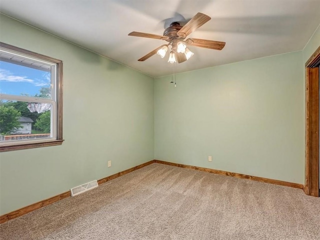 610 Morgan St, Lansing, KS 66043 - spare room with light carpet, a ceiling fan, and baseboards