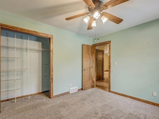 610 Morgan St, Lansing, KS 66043 - unfurnished bedroom featuring baseboards, carpet floors, a closet, and a ceiling fan
