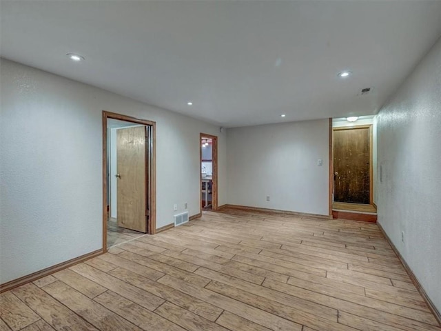 610 Morgan St, Lansing, KS 66043 - unfurnished room with light wood-style floors, recessed lighting, and baseboards