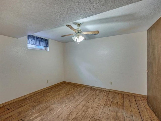 610 Morgan St, Lansing, KS 66043 - spare room with light wood-style floors, a textured ceiling, ceiling fan, and baseboards
