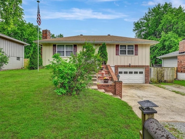 610 Morgan St, Lansing, KS 66043 - view of front facade with concrete driveway, an attached garage, a chimney, and board and batten siding
