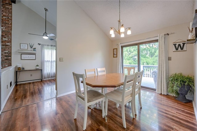 8961 Swarner Dr, Lenexa, KS 66219 - dining space with plenty of natural light, high vaulted ceiling, wood finished floors, a chandelier, and ceiling fan