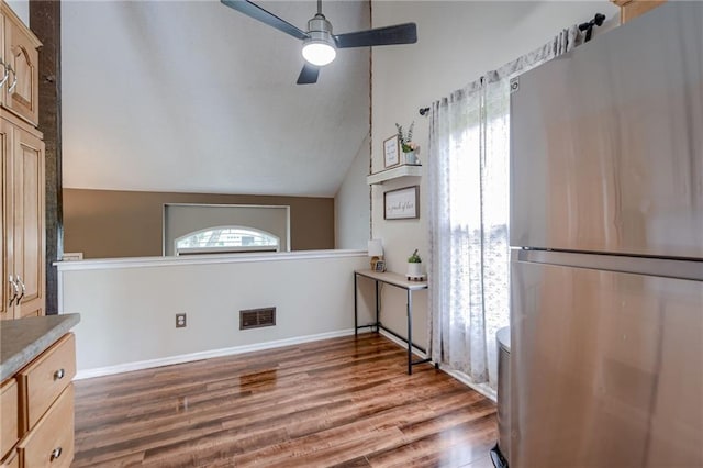 8961 Swarner Dr, Lenexa, KS 66219 - interior space featuring wood finished floors, vaulted ceiling, and ceiling fan
