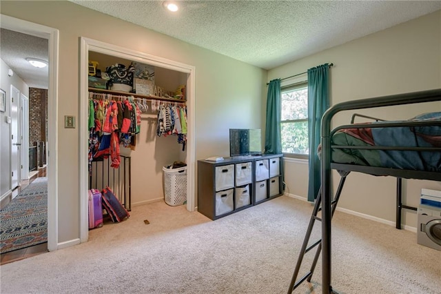 8961 Swarner Dr, Lenexa, KS 66219 - bedroom with a textured ceiling, carpet flooring, and a closet
