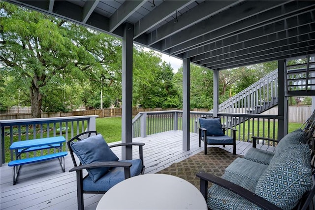 8961 Swarner Dr, Lenexa, KS 66219 - wooden deck with stairway, a fenced backyard, and view of wooded area