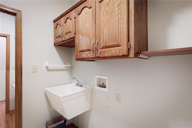 1404 NE Piedmont Dr, Lees Summit, MO 64064 - laundry room featuring cabinet space and hookup for a washing machine