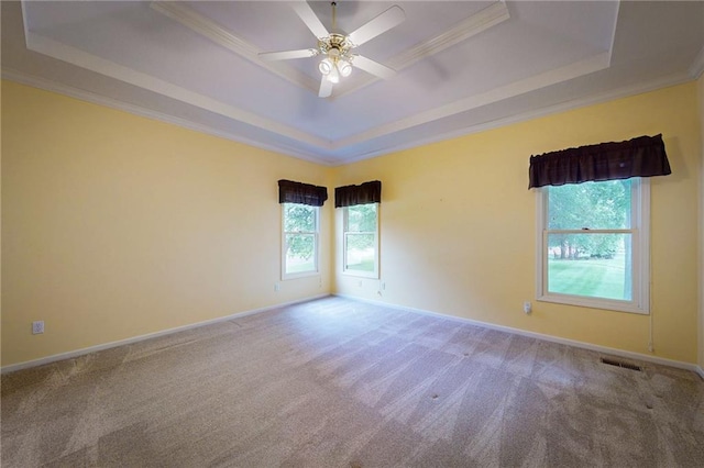 1404 NE Piedmont Dr, Lees Summit, MO 64064 - carpeted empty room featuring a tray ceiling, crown molding, a ceiling fan, and baseboards