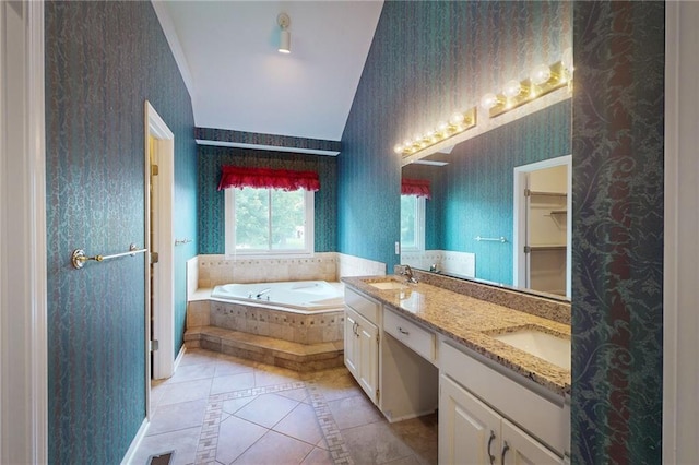 1404 NE Piedmont Dr, Lees Summit, MO 64064 - bathroom featuring wallpapered walls, a garden tub, tile patterned flooring, double vanity, and inlaid floor details
