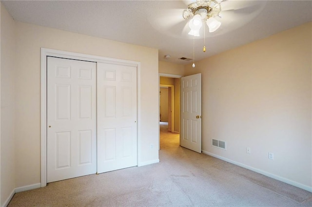 1404 NE Piedmont Dr, Lees Summit, MO 64064 - unfurnished bedroom featuring light colored carpet, baseboards, a closet, and a ceiling fan