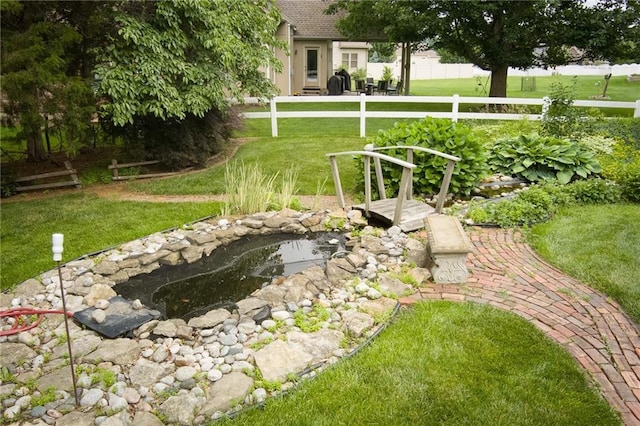 1404 NE Piedmont Dr, Lees Summit, MO 64064 - view of yard featuring a garden pond