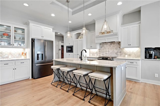 16394 S Loiret St, Olathe, KS 66062 - kitchen with stainless steel fridge, black microwave, white cabinets, tasteful backsplash, and recessed lighting