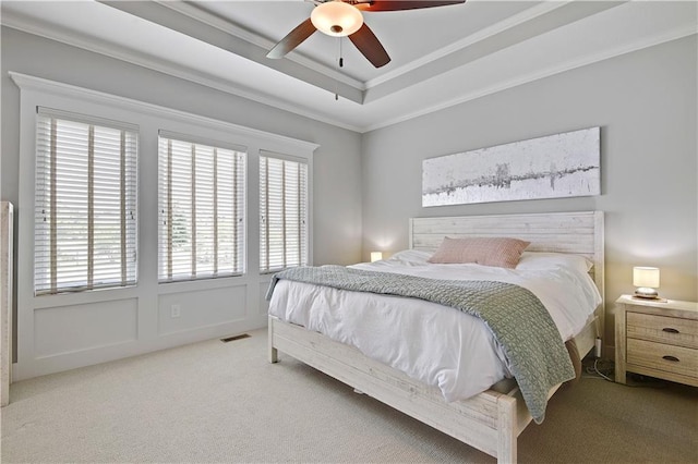 16394 S Loiret St, Olathe, KS 66062 - carpeted bedroom with a tray ceiling, ornamental molding, and ceiling fan