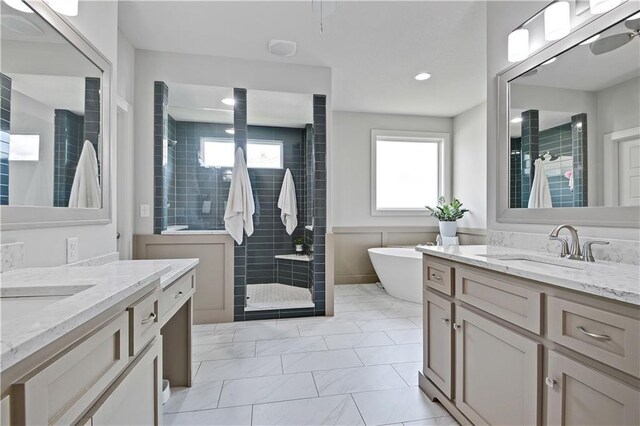 16394 S Loiret St, Olathe, KS 66062 - bathroom featuring tiled shower, two vanities, a soaking tub, recessed lighting, and marble look tile flooring