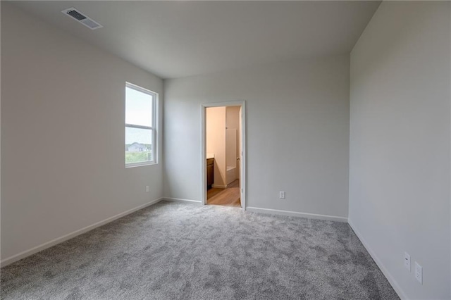 27027 E Oak View Dr, Lees Summit, MO 64086 - unfurnished bedroom with carpet, baseboards, and ensuite bathroom