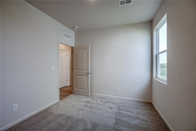 27027 E Oak View Dr, Lees Summit, MO 64086 - spare room with carpet and baseboards