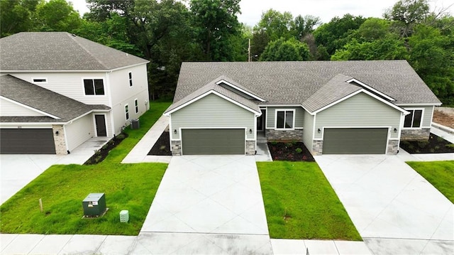 789 Highland Dr, Edwardsville, KS 66111 - view of front of property featuring driveway, a front yard, and cooling unit