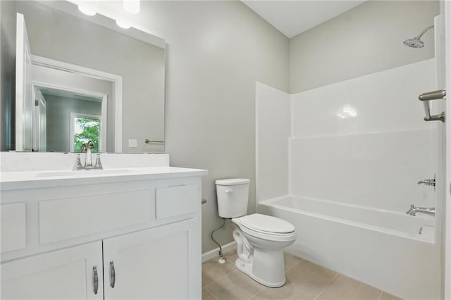 789 Highland Dr, Edwardsville, KS 66111 - full bathroom with toilet, vanity, baseboards, tile patterned floors, and shower / tub combination