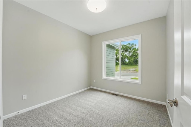 789 Highland Dr, Edwardsville, KS 66111 - carpeted spare room with baseboards