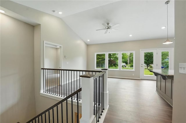 789 Highland Dr, Edwardsville, KS 66111 - hall with lofted ceiling, an upstairs landing, wood finished floors, and recessed lighting