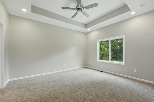 789 Highland Dr, Edwardsville, KS 66111 - spare room featuring carpet, baseboards, recessed lighting, a ceiling fan, and a raised ceiling