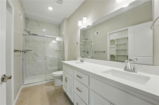 789 Highland Dr, Edwardsville, KS 66111 - full bathroom with a stall shower, double vanity, tile patterned flooring, toilet, and recessed lighting