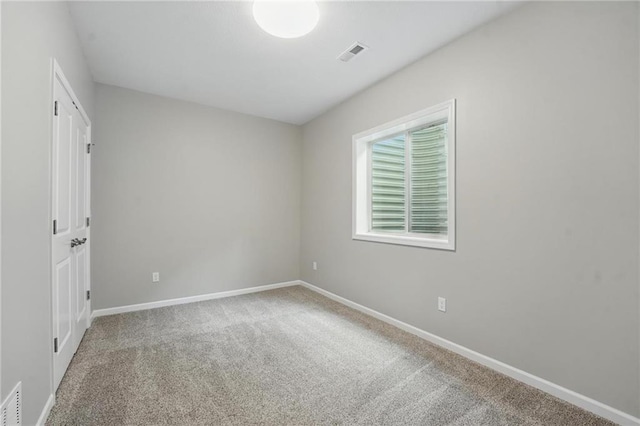 789 Highland Dr, Edwardsville, KS 66111 - carpeted spare room with baseboards