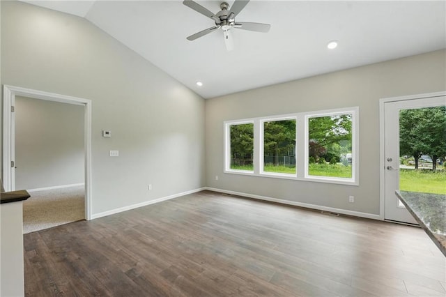 789 Highland Dr, Edwardsville, KS 66111 - empty room featuring plenty of natural light, a ceiling fan, wood finished floors, baseboards, and high vaulted ceiling