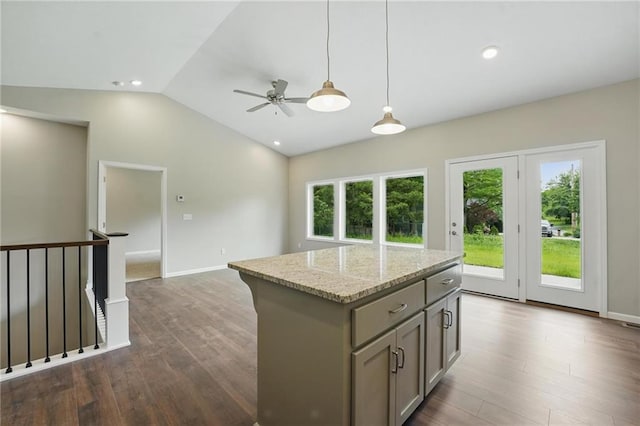789 Highland Dr, Edwardsville, KS 66111 - kitchen with gray cabinets, a center island, decorative light fixtures, dark wood-style flooring, and vaulted ceiling