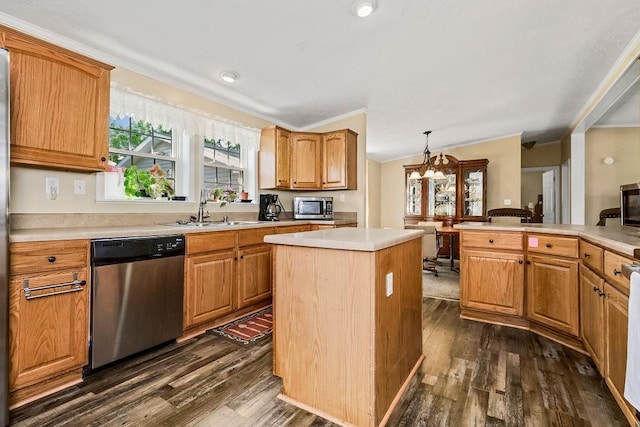 415 E Hulett St, Edgerton, KS 66021 - kitchen with appliances with stainless steel finishes, a sink, dark wood finished floors, crown molding, and light countertops