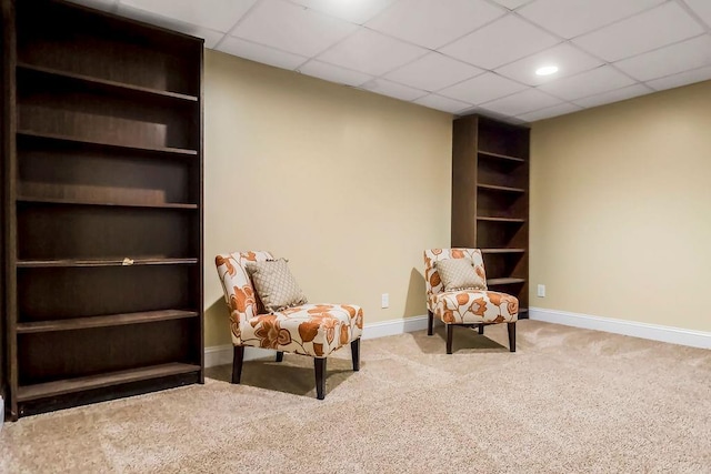 415 E Hulett St, Edgerton, KS 66021 - sitting room featuring carpet floors, baseboards, a drop ceiling, and recessed lighting
