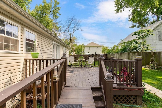 415 E Hulett St, Edgerton, KS 66021 - wooden deck featuring a fenced backyard and outdoor dining space