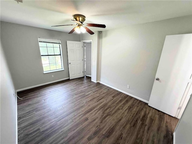 7134 Agnes Ave, Kansas City, MO 64132 - unfurnished bedroom featuring dark wood finished floors, baseboards, and a ceiling fan