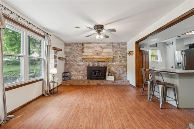 917 L St, Atchison, KS 66002 - living room featuring light wood-style floors, ceiling fan, and baseboards