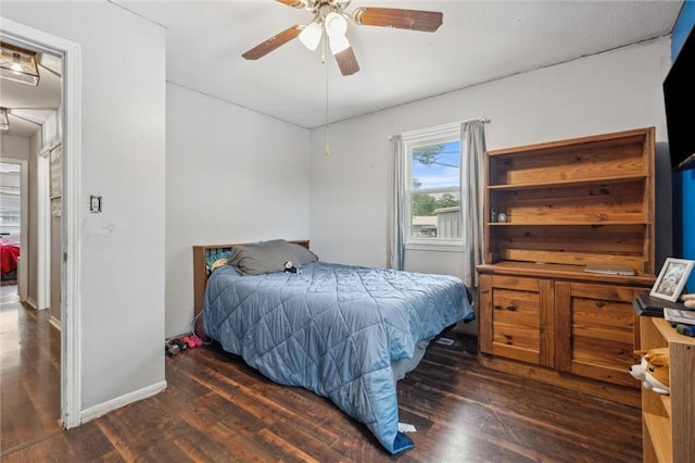 917 L St, Atchison, KS 66002 - bedroom with wood finished floors, baseboards, and ceiling fan