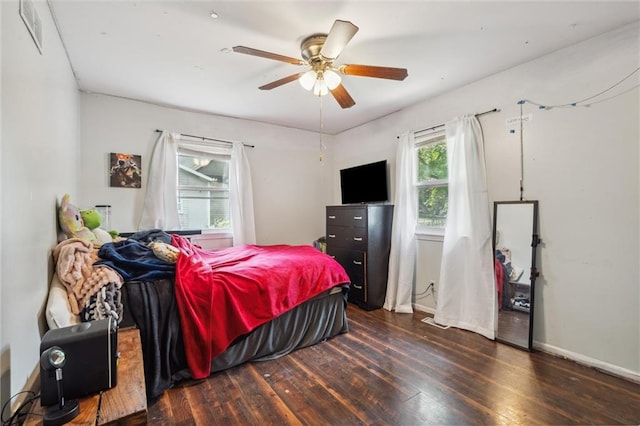 917 L St, Atchison, KS 66002 - bedroom featuring hardwood / wood-style flooring, baseboards, and ceiling fan
