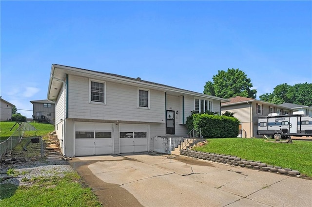 120 Highland Rd, Lansing, KS 66043 - raised ranch with a garage and driveway