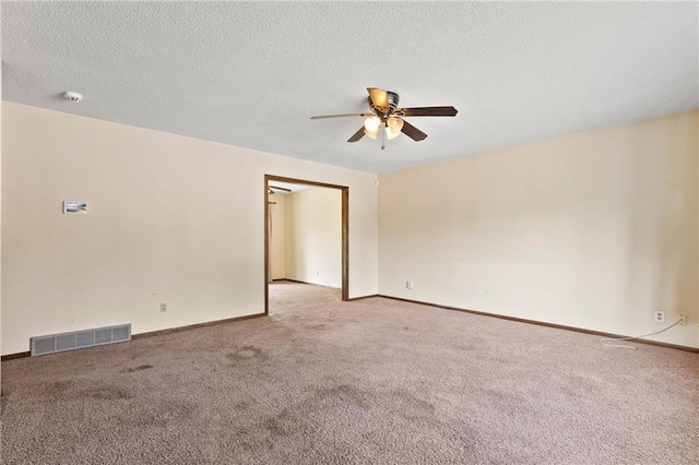 120 Highland Rd, Lansing, KS 66043 - carpeted empty room featuring a ceiling fan, baseboards, a textured ceiling, and a smoke detector