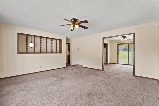 120 Highland Rd, Lansing, KS 66043 - empty room featuring a ceiling fan, light colored carpet, a textured ceiling, and baseboards