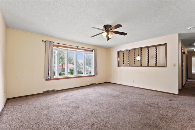 120 Highland Rd, Lansing, KS 66043 - carpeted empty room featuring a ceiling fan, a textured ceiling, and baseboards